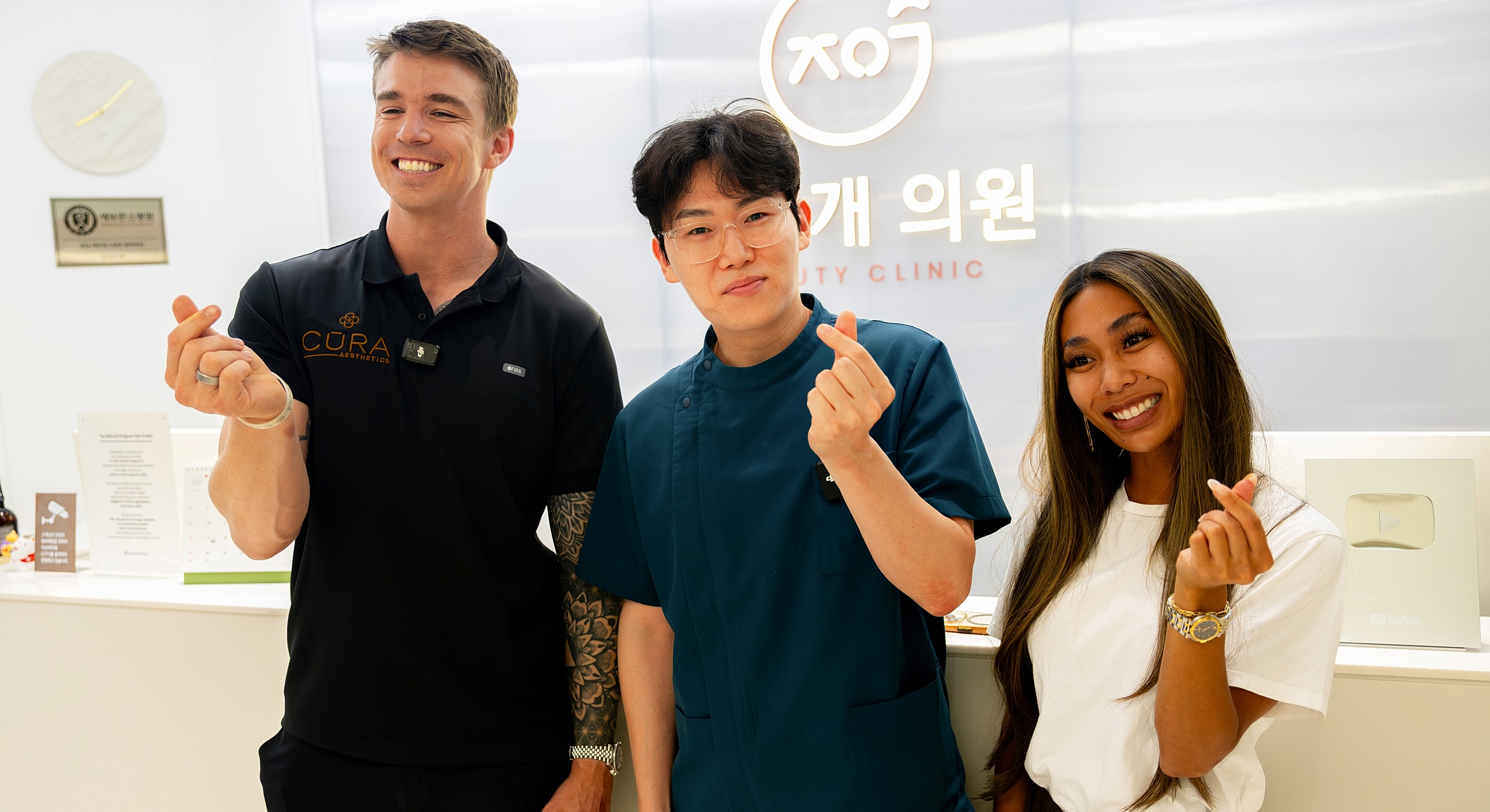 Three people smiling in a beauty clinic.